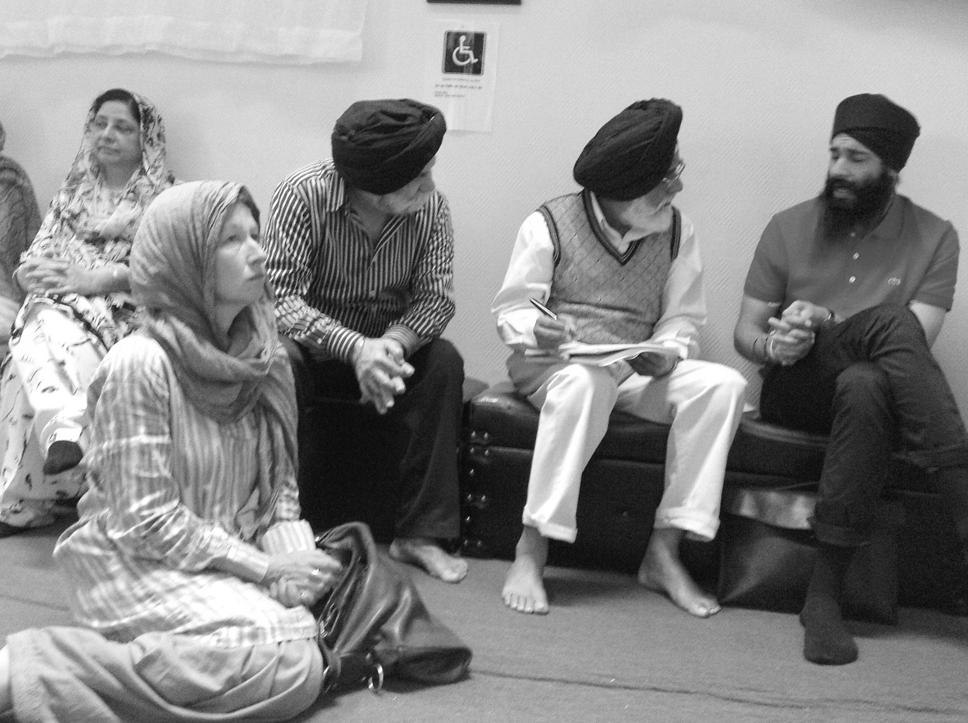 Norway Rajwant Parpatias with Norwegian Sikh Scholar Lill Vramo sitting on the floor, Oslo Gurdwara